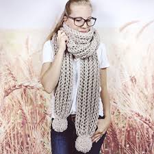 Winter wish scarf combines a variety of different stitches to create texture. Womens Oversized Extra Long Knitted Boho Scarf With Pom Poms In Linen Wheatfield Knitwear