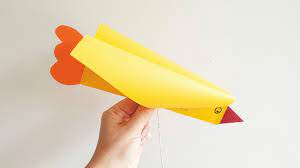 Start on the right of one side and start to glue down your paper over the kite string using your glue stick. How To Make A Super Easy Bird Kite Diy Thought