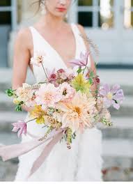 Garden roses are blooming left, right and centre which makes for a gorgeous addition to any outdoor wedding. What S In Season An Essential Guide To Summer Wedding Flowers Onefabday Com
