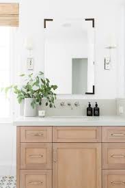A chic mirror is the easiest way to upgrade your bathroom—no renovation required. Frameless Bathroom Mirror Ideas Easy Budget Upgrades Apartment Therapy