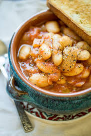 Greek Gigantes Are Not Surprisingly Giant Beans In This Recipe The Gigantes Are Slow Cooked In A Rich Tomato Sauce Greek Recipes Bean Recipes Greek Cooking