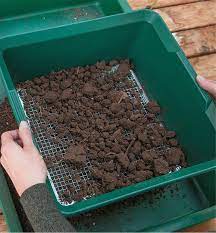 How to use a soil sifter check out my video to see it in action, but all you do is set the sifter down over the top of a wheelbarrow, shovel the dirt on top, and then shake your money maker to get the small stuff to fall through. Deep Soil Sieve Lee Valley Tools