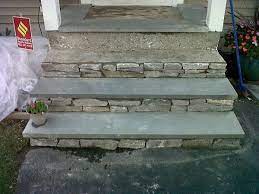 Brown closed wooden door with window and concrete steps. Great Idea To Reface Concrete Steps I Stole This Idea From Cement Front Steps Front Steps Concrete Front Steps