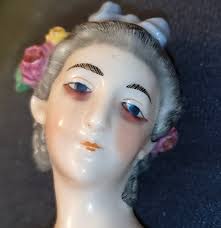 Hi I recently got this half doll pin cushion and it is unmarked and nothing  comes up