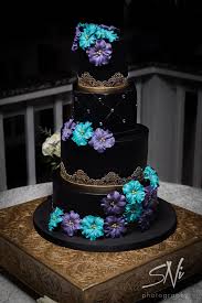Black And Blue Wedding Cake Black And Gold Buttercream Wedding Cake With Blue And Purple Sugar Flowers By Party Flavors Wedding Cake Blue Gold Wedding Cake Flowers Blue Cool Wedding Cakes