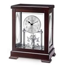 The bulova vantage tabletop clock has a black stained solid wood base and top with a high gloss finish. Tabletop Collection