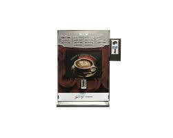 Water and coffee beans go in, beans are ground, water is heated to a boiling point, pumped as a steam, the ground coffee is compressed, steam is passed through the ground coffee, through the dispenser and into the coffee cup. Godrej Vending Machine Minifresh Espresso Combo With Visible Bean Hopper