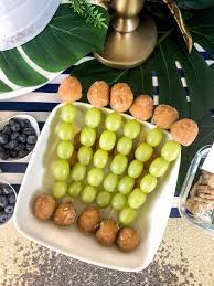 Hanging palm tree garlands around the venue is a great way to set the safari tone. Glam Safari Baby Shower Parties With A Cause