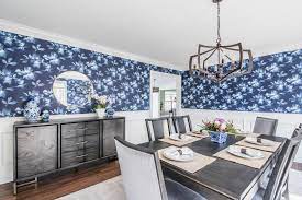 Located just off the kitchen, the open dining room with a round pedestal table and upholstered vintage blue dining chairs offers a comfortable and stylish space for sharing meals at home. 100 Top Designer Dining Rooms Hgtv