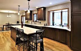 Main cabinets were painted in white and topped with flat nosed marble for a more modern profile and the large kitchen island goes for a solid teak wood finish. Before And After Open Concept Kitchen Remodel Capitol Kitchens Bath