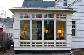 How Much Does It Cost To Build A Sunroom Addition Four Seasons Room Windows House With Porch Porch Cost Building A Porch