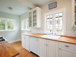Wood floors with white trim. Painting Strategies That Make A Small Kitchen Look Larger