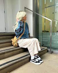 Just dropped: Vans Knu Skool 👀 → https://bit.ly/Vans-KnuSkool As seen on  @Steezyy_Steve_ 📸 ID: An image of a person wearing black Vans trainers,  cream trousers and a blue jacket whilst sitting on