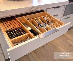 Kitchen island cabinets are not used for decorative purposes only, but they are more commonly used for storage and convenience. White Cabinets With A Gray Kitchen Island Homecrest