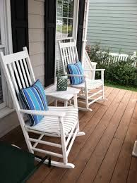 White Rocking Chairs On Front Porch With Summer Perfect Sunbrella Pillows And Ombre Lantern Front Porch Furniture Porch Furniture Patio Furniture