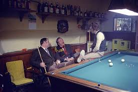 Italian Actor Duilio Del Prete Sitting On A Pool Table And Chatting With French Actor Philippe Noiret And Italian Act Maurice Pialat Pierre Tchernia Jean Gabin