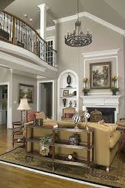 High Ceilings Always Gives The Illusion Of Abundant Space Vaulted Ceiling Living Room Transitional Living Room Design Family Room Colors