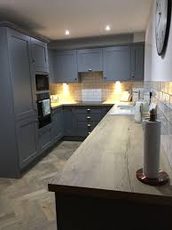 Grey Painted Solid Wood Shaker With Wooden Effect Laminate Worktops Grey Shaker Kitchen Laminate Worktop Laminate Kitchen