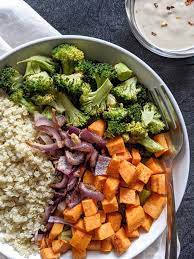 A fast and easy side dish, your family will love these sweet and caramelized balsamic roasted sweet potatoes, cauliflower and onions. Roasted Sweet Potato Broccoli Buddha Bowl With Maple Tahini Dressing Hayl S Kitchen