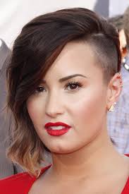 If at her beginnings, she presents rather wise cuts and remains rather faithful to the nature of her slightly curly hair and her natural brown, over the course of her success, demi changes color. Demi Lovato Wavy Medium Brown Ombre Side Part Sideswept Bangs Undercut Hairstyle Steal Her Style