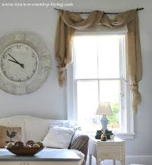 Susie watson offers a charming and traditional range of fabric designs, feauturing vintage, country patterns with a homemade feel. Curtain Swags Made By Draping Landscape Burlap Over Branch Hung On The Wall Via Town And C Apartment Decorating On A Budget Window Treatments Living Room Home