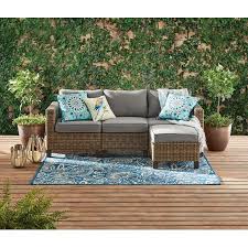 This white patio set comes with a settee and two chairs adorned with colorful cushions, as well as a coffee table for that. Better Homes Gardens Sandcrest Seagrass Outdoor Wicker 4 Piece Conversation Set With Adjustable Table Accuweather Shop