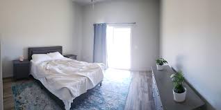A welcoming scandinavian bedroom with a white bed, a metal chair, a rug and an artwork. Any Recommendations On How To Add More Scandinavian Style To My Bedroom Scandinavianinterior