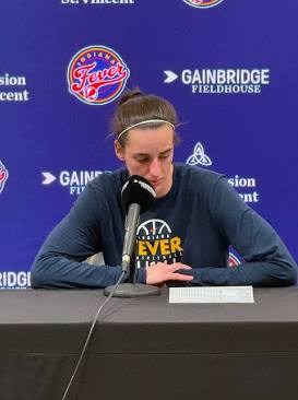 Caitlin Clark during postgame media session, do AI tạo