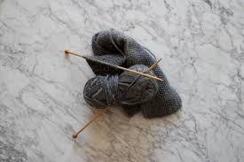 Double pointed needles may seem scary at first, but learning how to knit with double pointed needles will improve your knitting game in so many ways. Image Of Knitting With Wooden Knitting Needles And Grey Wool On Marble Austockphoto
