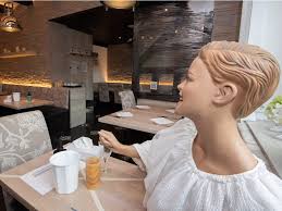 Wooden chairs and table of a cafe; Ways Restaurants Are Getting Social Distancing Right