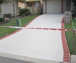 Begin planning for your concrete driveway by driving wood stakes into the ground. Driveway Paint The Best One How To Apply It Brad The Painter