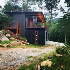 Steve's primary concern was security and he said that shipping containers' large steel doors can be locked to keep his home secure and free from vandals while he is away. Appalachian Container Cabin In Otto North Carolina Container House Design Container House Container Cabin