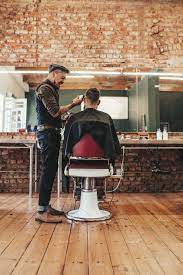 Hairdresser Giving Haircut To Client Barber Shop Interior Barber Shop Decor Best Barber Shop