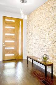 Contemporary Entry With Stone Feature Wall Timber Flooring And Modern Entry Door With Side Glass Panel Stone Feature Wall Stone Walls Interior Wall Exterior