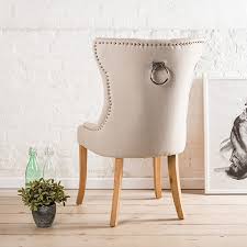 Add extra seating with a contemporary flair by choosing a bench for your dining room. Alma Wing Back Upholstered Dining Chair