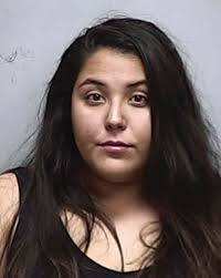 Woman charged with street racing in Sunday crash