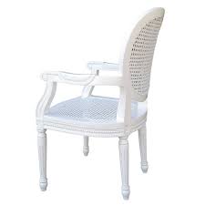 Painted finishes in understated creams or gentle greys have a scandinavian feel and fit in with both bright and neutral colour schemes. French Chateau White Rattan Dining Bedroom Arm Chair Furniture La Maison Chic Luxury Interiors