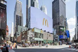 Nighttime view of the illuminated marquee of the mcdonald's. Mcdonald S Opens A Flashy Three Story Times Square Location Today Eater Ny