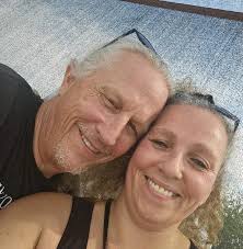 H. Schupfer and Phil Johns sit