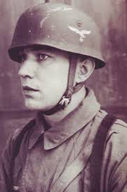 A Fallschirmjäger wearing an early single decal M38 Sprunghelm in his  studio portrait.