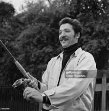 English actor and television presenter Eric Thompson with a ...