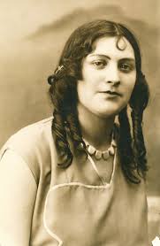 What is the meaning of the arm band in the 1946 photo?