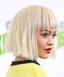 This link is to an external site that may or may not meet accessibility guidelines. Rita Ora Medium Straight Light Blonde Bob Haircut With Blunt Cut Bangs
