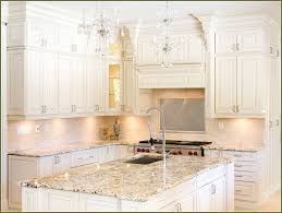 The black shaker cabinets in this sleek contemporary kitchen are dramatic and give a bold contrast to the bright white walls. Off White Kitchen Cabinets Color Scheme Gbvims Home Makeover Best Option Color Off White Kitchen Cabinets