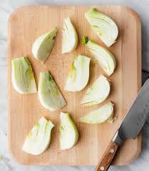 Use a sharp knife to cut the brown, dry root portion of the fennel off. K Zgtj49l L9hm