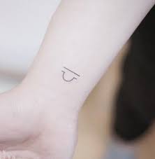 Tiny Libra Tattoo Inkstylemag Libra Tattoo Libra Tattoo Small Tattoos
