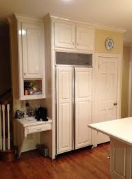 Upper kitchen cabinets are most often used for storing dishes, glasses and dinnerware, but they can also be used to store spices, mixing bowls and small appliances clean out your cabinets and decide what should go where. Desk In The Kitchen Is It A Feature Of The Past Designed