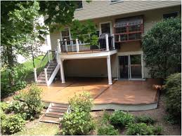 To continue with the handrail design and construction, navigate to stair railing. Creating An Outdoor Deck Design Above A Walkout Patio Amazing Decks