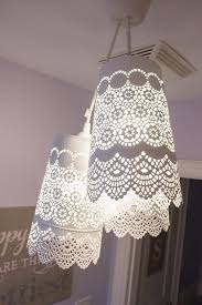 A Pretty And Delicate Lace Like Pendant Chandelier Made For Less Than 35 Using Three Metal Candle Holders And A Triple Pen Diy Chandelier Chandelier Ikea Hack