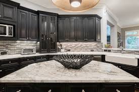 Black kitchen cabinets with white marble countertops. Black And White Kitchen White Kitchen Marble Island Fantasy Brown